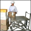 Rustfrit saksebord med hjul til h�ndtering af f�devarer